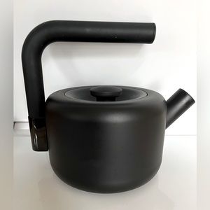 Modern black whistling tea kettle